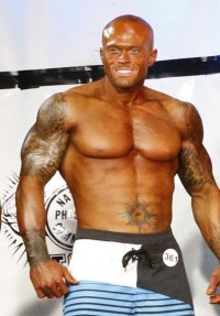 2012 NPC Men's Master's National Physique Competitor John Quinlan on Stage Image 5.jpg