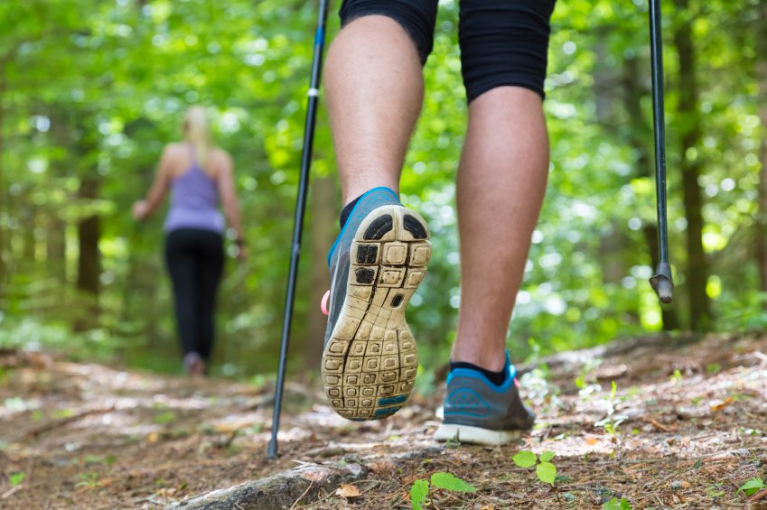 Young couple hiking in nature. Sport and exercise.